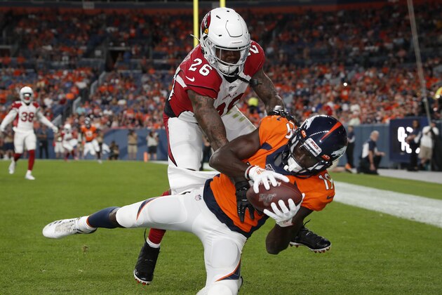 Denver Broncos wide receiver Fred Brown (19) makes a touchdown catch as Arizona Cardinals cornerback Brandon Williams (26) defends during the first half of an NFL preseason football game, Thursday, Aug. 29, 2019, in Denver. (AP Photo/David Zalubowski)