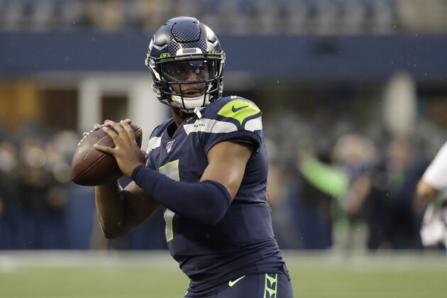 Seattle Seahawks quarterback Geno Smith passes during warmups before an NFL football preseason game against the Oakland Raiders, Thursday, Aug. 29, 2019, in Seattle. (AP Photo/Elaine Thompson)