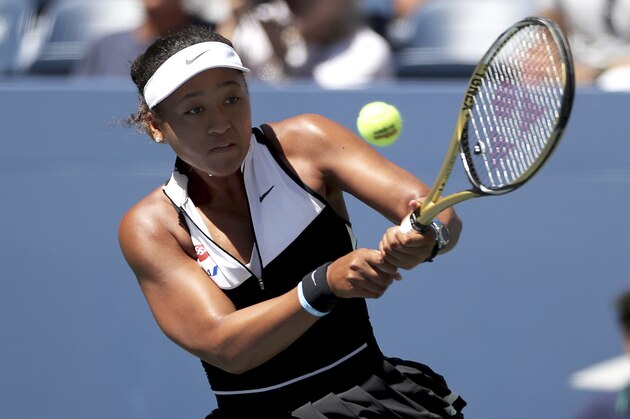 Naomi Osaka, of Japan, returns a shot to Magda Linette, of Poland, during the second round of the US Open tennis championships Thursday, Aug. 29, 2019, in New York. (AP Photo/Eduardo Munoz Alvarez)