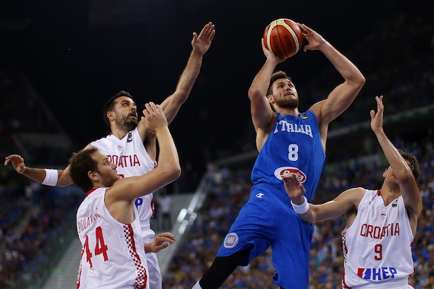 Italy's power forward Danilo Gallinari  tries to score past Croatia's forward Dario Saric (R ) during the final match of the Olympic Qualifying Tournament Croatia vs Italy at PalaIsozaki in Turin on July 9, 2016. / AFP / MARCO BERTORELLO        (Photo credit should read MARCO BERTORELLO/AFP/Getty Images)