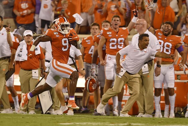 Clemson's Travis Etienne runs down the sideline for a 90-yard touchdown during the first half of an NCAA college football game against Georgia Tech Thursday, Aug. 29, 2019, in Clemson, S.C. (AP Photo/Richard Shiro)