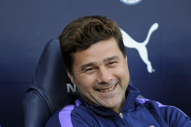 Tottenham's manager Mauricio Pochettino looks out from the bench prior the English Premier League soccer match between Manchester City and Tottenham Hotspur at Etihad stadium in Manchester, England, Saturday, Aug. 17, 2019. (AP Photo/Rui Vieira)