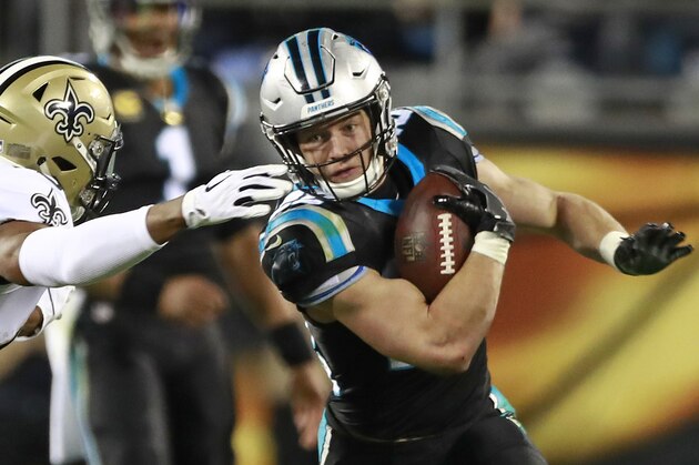 FILE - In this Dec. 17, 2018, file photo, Carolina Panthers' Christian McCaffrey, right, tries to run past New Orleans Saints' Marcus Williams in the second half of an NFL football game in Charlotte, N.C. Second-team All-Pro running back Christian McCaffrey had 326 touches last season and the Panthers want to increase that number even more this year _ all while cutting his overall number of plays on the field. (AP Photo/Jason E. Miczek, File)
