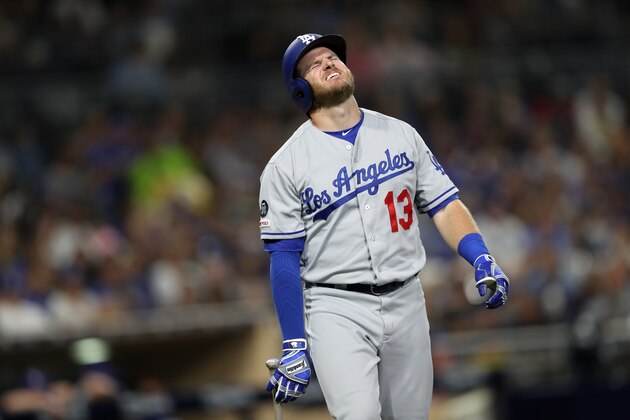 SAN DIEGO, CALIFORNIA - AUGUST 28:  Max Muncy #13 of the Los Angeles Dodgers reacts after being hit by a pitch during the fifth inning of a game against the San Diego Padres at PETCO Park on August 28, 2019 in San Diego, California.  Muncy left the game after being examined by trainers. (Photo by Sean M. Haffey/Getty Images)