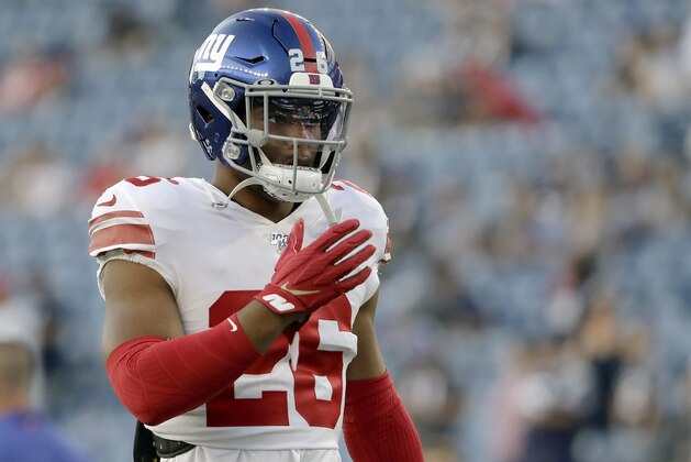 New York Giants running back Saquon Barkley warms up before an NFL preseason football game against the New England Patriots, Thursday, Aug. 29, 2019, in Foxborough, Mass. (AP Photo/Steven Senne)