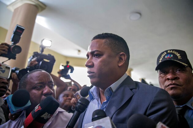 Dominican former Major League Baseball player Octavio Dotel, who was arrested on suspicion of being linked to a powerful drug trafficking network, is surrounded by the press as he is escorted upon his arrival at a courthouse for a hearing in Santo Domingo, on August 26, 2019. - Dotel was arrested last week shortly before attorney general Jean Alain Rodriguez announced the dismantling of the country's largest drug gang, led by Cesar Emilio Peralta, who is fugitive. Dotel's defense has denied any ties to the gang. (Photo by Erika SANTELICES / AFP)        (Photo credit should read ERIKA SANTELICES/AFP/Getty Images)