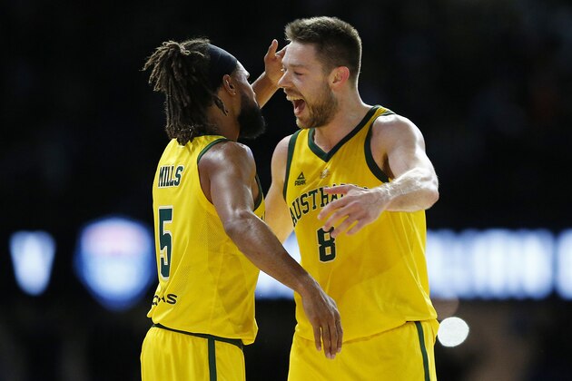 MELBOURNE, AUSTRALIA - AUGUST 24: Patty Mills of the Boomers (L) celebrates with Matthew Dellavedova of the Boomers during game two of the International Basketball series between the Australian Boomers and United States of America at Marvel Stadium on August 24, 2019 in Melbourne, Australia. (Photo by Daniel Pockett/Getty Images)