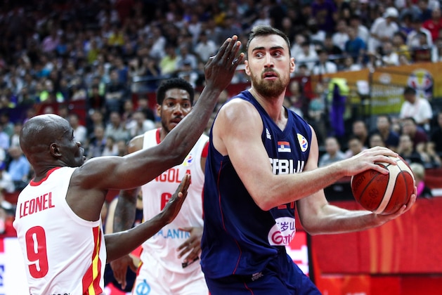 FOSHAN, CHINA - AUGUST 31: #21 Nikola Milutinov of the Serbia National Team in action against #9 Leonel Paulo of the Angola National Team during the 1st round of 2019 FIBA World Cup at GBA International Sports and Cultural Center on August 31, 2019 in Foshan, China.  (Photo by Zhong Zhi/Getty Images)