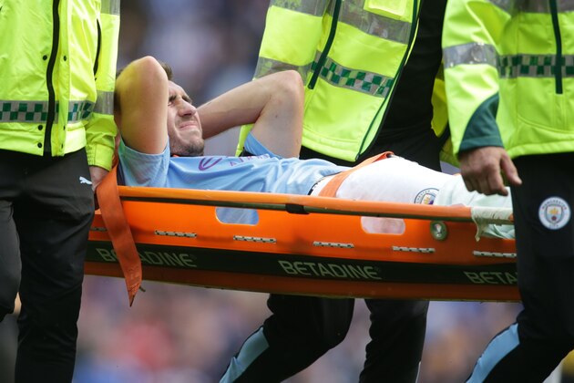 Manchester City's French defender Aymeric Laporte is taken off on a stretcher after picking up an injury during the English Premier League football match between Manchester City and Brighton and Hove Albion at the Etihad Stadium in Manchester, north west England, on August 31, 2019. (Photo by Lindsey Parnaby / AFP) / RESTRICTED TO EDITORIAL USE. No use with unauthorized audio, video, data, fixture lists, club/league logos or 'live' services. Online in-match use limited to 120 images. An additional 40 images may be used in extra time. No video emulation. Social media in-match use limited to 120 images. An additional 40 images may be used in extra time. No use in betting publications, games or single club/league/player publications. /         (Photo credit should read LINDSEY PARNABY/AFP/Getty Images)