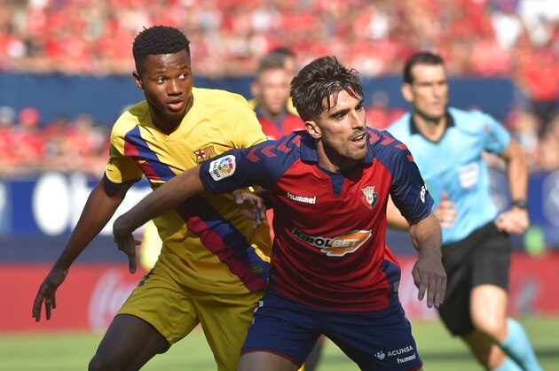 Barcelona´s Guinea-Bissau forward Ansu Fati (L) challenges Osasuna's Spanish defender Nacho Vidal during the Spanish league football match CA Osasuna against FC Barcelona at El Sadar stadium in Pamplona on August 31, on 2019. (Photo by ANDER GILLENEA / AFP)        (Photo credit should read ANDER GILLENEA/AFP/Getty Images)