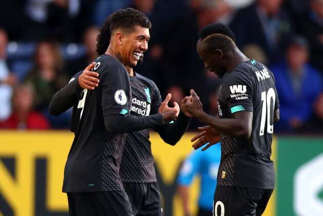 BURNLEY, ENGLAND - AUGUST 31: Roberto Firmino of Liverpool celebrates scoring his teams third goal during the Premier League match between Burnley FC and Liverpool FC at Turf Moor on August 31, 2019 in Burnley, United Kingdom. (Photo by Chloe Knott - Danehouse/Getty Images)