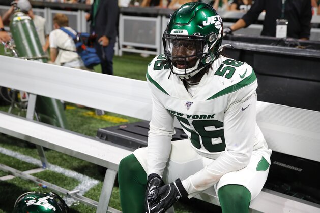 ATLANTA, GA - AUGUST 15: Jachai Polite #56 of the New York Jets rests on the bench during the second half of an NFL preseason game against the Atlanta Falcons at Mercedes-Benz Stadium on August 15, 2019 in Atlanta, Georgia. (Photo by Todd Kirkland/Getty Images)