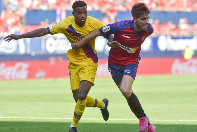 Barcelona´s Guinea-Bissau forward Ansu Fati (L) challenges Osasuna's Spanish defender Nacho Vidal during the Spanish league football match CA Osasuna against FC Barcelona at El Sadar stadium in Pamplona on August 31, on 2019. (Photo by ANDER GILLENEA / AFP) (Photo credit should read ANDER GILLENEA/AFP/Getty Images) Barcelona´s Guinea-Bissau forward Ansu Fati (L) challenges Osasuna's Spanish defender Nacho Vidal during the Spanish league football match CA Osasuna against FC Barcelona at El Sadar stadium in Pamplona on August 31, on 2019. (Photo by ANDER GILLENEA / AFP) (Photo credit should read ANDER GILLENEA/AFP/Getty Images)