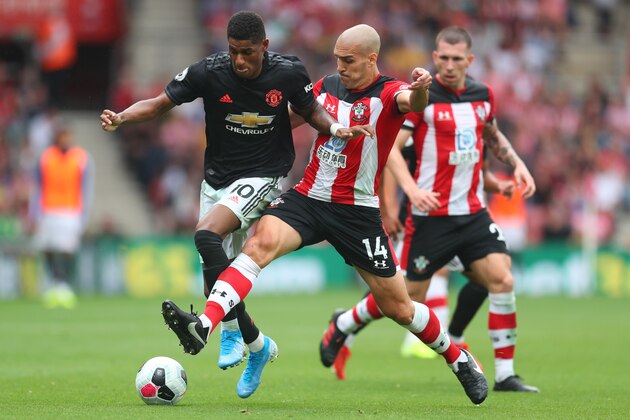 SOUTHAMPTON, ENGLAND - AUGUST 31: Oriol Romeu of Southampton tackles Marcus Rashford of Manchester United during the Premier League match between Southampton FC and Manchester United at St Mary's Stadium on August 31, 2019 in Southampton, United Kingdom. (Photo by Catherine Ivill/Getty Images)