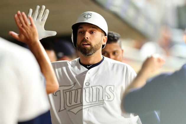 MINNEAPOLIS, MN - AUGUST 23: Jake Cave #60 of the Minnesota Twins celebrates his solo home run with his team in the dugout during the fifth inning against the Detroit Tigers at Target Field on August 23, 2019 in Minneapolis, Minnesota. Teams are wearing special color schemed uniforms with players choosing nicknames to display for Players' Weekend. (Photo by Adam Bettcher/Getty Images)