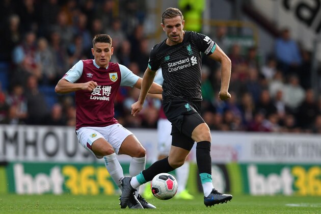 Burnley's English midfielder Ashley Westwood (L) vies with Liverpool's English midfielder Jordan Henderson (R) during the English Premier League football match between Burnley and Liverpool at Turf Moor in Burnley, north west England on August 31, 2019. (Photo by Paul ELLIS / AFP) / RESTRICTED TO EDITORIAL USE. No use with unauthorized audio, video, data, fixture lists, club/league logos or 'live' services. Online in-match use limited to 120 images. An additional 40 images may be used in extra time. No video emulation. Social media in-match use limited to 120 images. An additional 40 images may be used in extra time. No use in betting publications, games or single club/league/player publications. /         (Photo credit should read PAUL ELLIS/AFP/Getty Images)