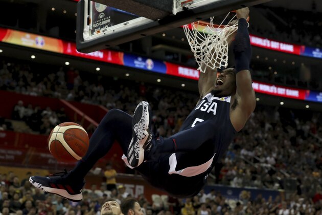 United States' Donovan Mitchell dunks during a Group E match against Czech Republic for the FIBA Basketball World Cup at the Shanghai Oriental Sports Center in Shanghai on Sunday, Sept. 1, 2019. U.S. defeats Czech Republic 88-67. (AP Photo/Ng Han Guan)