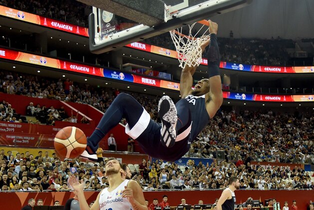 Donovan Mitchell of the US dunks the ball during the Basketball World Cup Group E game between Czech Republic and US in Shanghai on September 1, 2019. (Photo by HECTOR RETAMAL / AFP)        (Photo credit should read HECTOR RETAMAL/AFP/Getty Images)