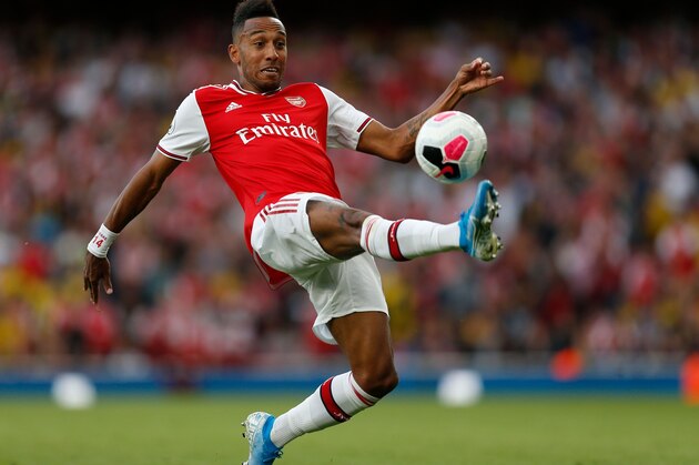 Arsenal's Gabonese striker Pierre-Emerick Aubameyang controls the ball during the English Premier League football match between Arsenal and Tottenham Hotspur at the Emirates Stadium in London on September 1, 2019. (Photo by Ian KINGTON / IKIMAGES / AFP) / RESTRICTED TO EDITORIAL USE. No use with unauthorized audio, video, data, fixture lists, club/league logos or 'live' services. Online in-match use limited to 45 images, no video emulation. No use in betting, games or single club/league/player publications.        (Photo credit should read IAN KINGTON/AFP/Getty Images)