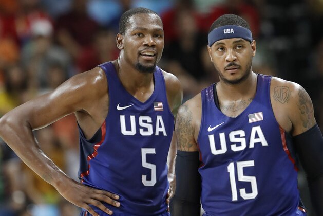 United States’ Kevin Durant (5) stands with teammate Carmelo Anthony (15) as questions a foul call during a men's semifinal round basketball game against Spain at the 2016 Summer Olympics in Rio de Janeiro, Brazil, Friday, Aug. 19, 2016. (AP Photo/Eric Gay)