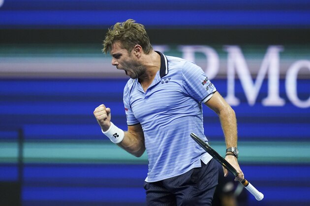 Stan Wawrinka, of Switzerland, celebrates after winning the first set against Novak Djokovic, of Serbia, during round four of the U.S. Open tennis championships Sunday, Sept. 1, 2019, in New York. (AP Photo/Eduardo Munoz Alvarez)