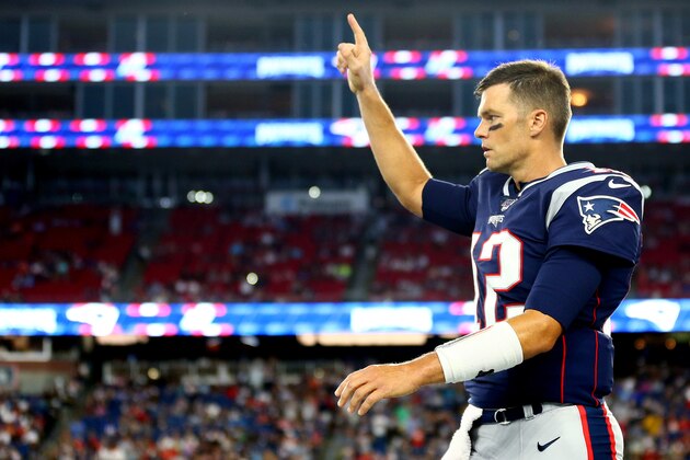 FOXBOROUGH, MASSACHUSETTS - AUGUST 22: Tom Brady #12 of the New England Patriots gestures to a teammate during the preseason game between the Carolina Panthers and the New England Patriots at Gillette Stadium on August 22, 2019 in Foxborough, Massachusetts. (Photo by Maddie Meyer/Getty Images)