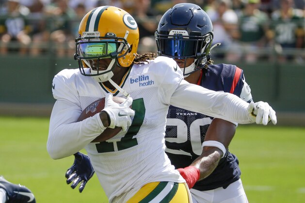 Green Bay Packers' Davante Adams tries to get away from the defensive pressure of Houston Texans' Justin Reid during a joint NFL football practice Monday, Aug 5, 2019, in Green Bay, Wis. (AP Photo/Mike Roemer)