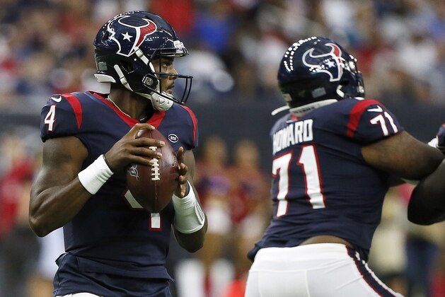 HOUSTON, TEXAS - AUGUST 17: Deshaun Watson #4 of the Houston Texans looks for a receiver as he receives protection from Tytus Howard #71 during a preseason game against the Detroit Lions at NRG Stadium on August 17, 2019 in Houston, Texas. (Photo by Bob Levey/Getty Images)