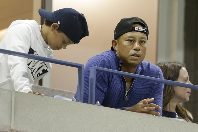 Golfer Tiger Woods watches a match between Rafael Nadal, of Spain, and Marin Cilic, of Croatia, during the fourth round of the U.S. Open tennis tournament, Monday, Sept. 2, 2019, in New York. (AP Photo/Seth Wenig)