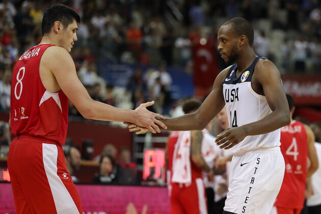 SHANGHAI, CHINA - SEPTEMBER 03: #14 Khris Middleton of USA greets #8 Ersan Ilyasova of Turkey after USA defeating Turkey in extra time during the 1st round match between USA and Turkey of 2019 FIBA World Cup at Shanghai Oriental Sports Center on September 03, 2019 in Shanghai, China. (Photo by Yifan Ding/Getty Images)