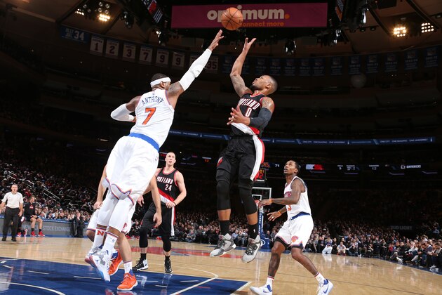 NEW YORK, NY - NOVEMBER 22:  Damian Lillard #0 of the Portland Trail Blazers shoots over Carmelo Anthony #7 of the New York Knicks on November 22, 2016 at Madison Square Garden in New York City, New York.  NOTE TO USER: User expressly acknowledges and agrees that, by downloading and or using this photograph, User is consenting to the terms and conditions of the Getty Images License Agreement. Mandatory Copyright Notice: Copyright 2016 NBAE  (Photo by Nathaniel S. Butler/NBAE via Getty Images)
