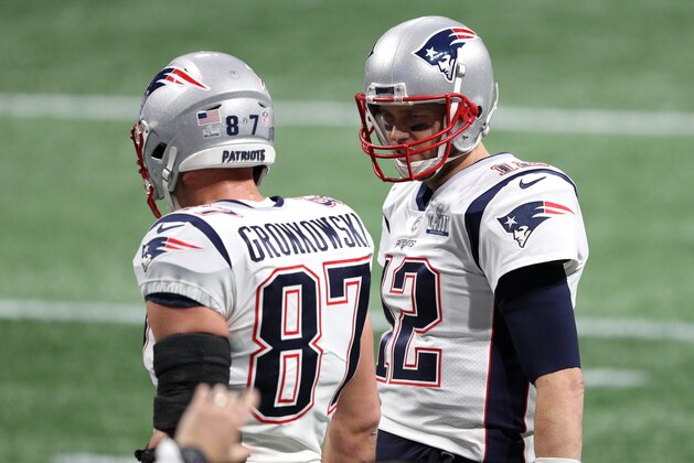 ATLANTA, GEORGIA - FEBRUARY 03:  Rob Gronkowski #87 and Tom Brady #12 of the New England Patriots speak to each other prior to Super Bowl LIII at Mercedes-Benz Stadium on February 03, 2019 in Atlanta, Georgia. (Photo by Patrick Smith/Getty Images)