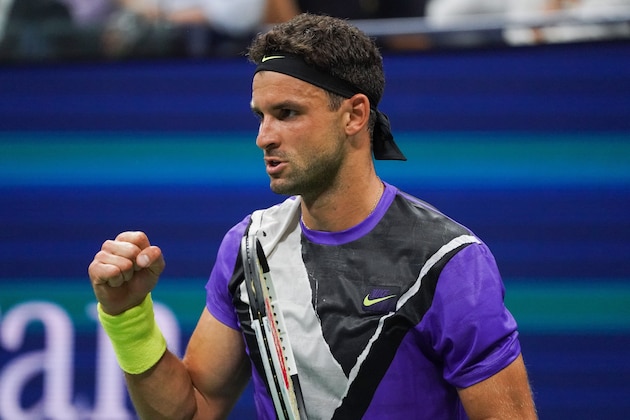 Grigor Dimitrov of Bulgaria reacts to his set point against Roger Federer of Switzerland in their Men's Singles Quarter-finals tennis match during the 2019 US Open at the USTA Billie Jean King National Tennis Center in New York on September 3, 2019. (Photo by DOMINICK REUTER / AFP)        (Photo credit should read DOMINICK REUTER/AFP/Getty Images)