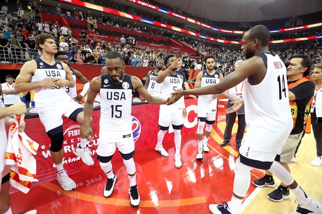 SHANGHAI, CHINA - SEPTEMBER 3: Kemba Walker #15 and Khris Middleton #14 of USA high five during the game against Turkey during the First Round of the 2019 FIBA Basketball World Cup on September 3, 2019 at the Shanghai Oriental Sports Center in Shanghai, China. NOTE TO USER: User expressly acknowledges and agrees that, by downloading and/or using this photograph, user is consenting to the terms and conditions of the Getty Images License Agreement. Mandatory Copyright Notice: Copyright 2019 NBAE (Photo by Nathaniel S. Butler/NBAE via Getty Images)