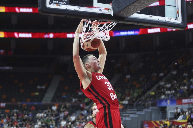Canada's Kyle Wiltjer dunks during a Group H match against Lithuania for the FIBA Basketball World Cup 2019 in Dongguan in south China's Guangdong province on Tuesday, Sep. 3, 2019. Lithuania won over Canada 92-69. (AP Photo)