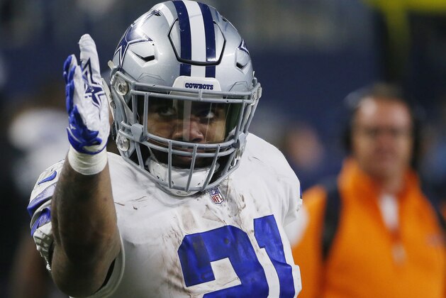 Dallas Cowboys running back Ezekiel Elliott (21) signals a first down after long run in the first half of the NFC wild-card NFL football game against the Seattle Seahawks, in Arlington, Texas, Saturday, Jan. 5, 2019. (AP Photo/Ron Jenkins)