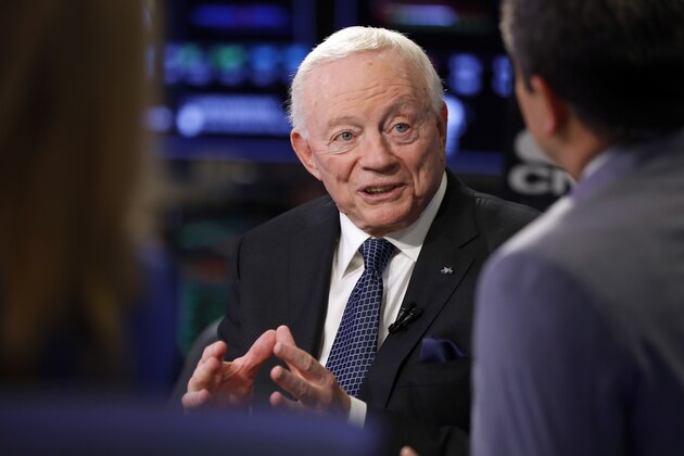 Dallas Cowboys owner Jerry Jones is interviewed on the floor of the New York Stock Exchange, Wednesday, Sept. 4, 2019. The Dallas Cowboys and Ezekiel Elliott have agreed on a $90 million, six-year contract extension that will make him the NFL's highest-paid running back and end a holdout that lasted the entire preseason, a person with knowledge of the agreement said Wednesday. (AP Photo/Richard Drew)