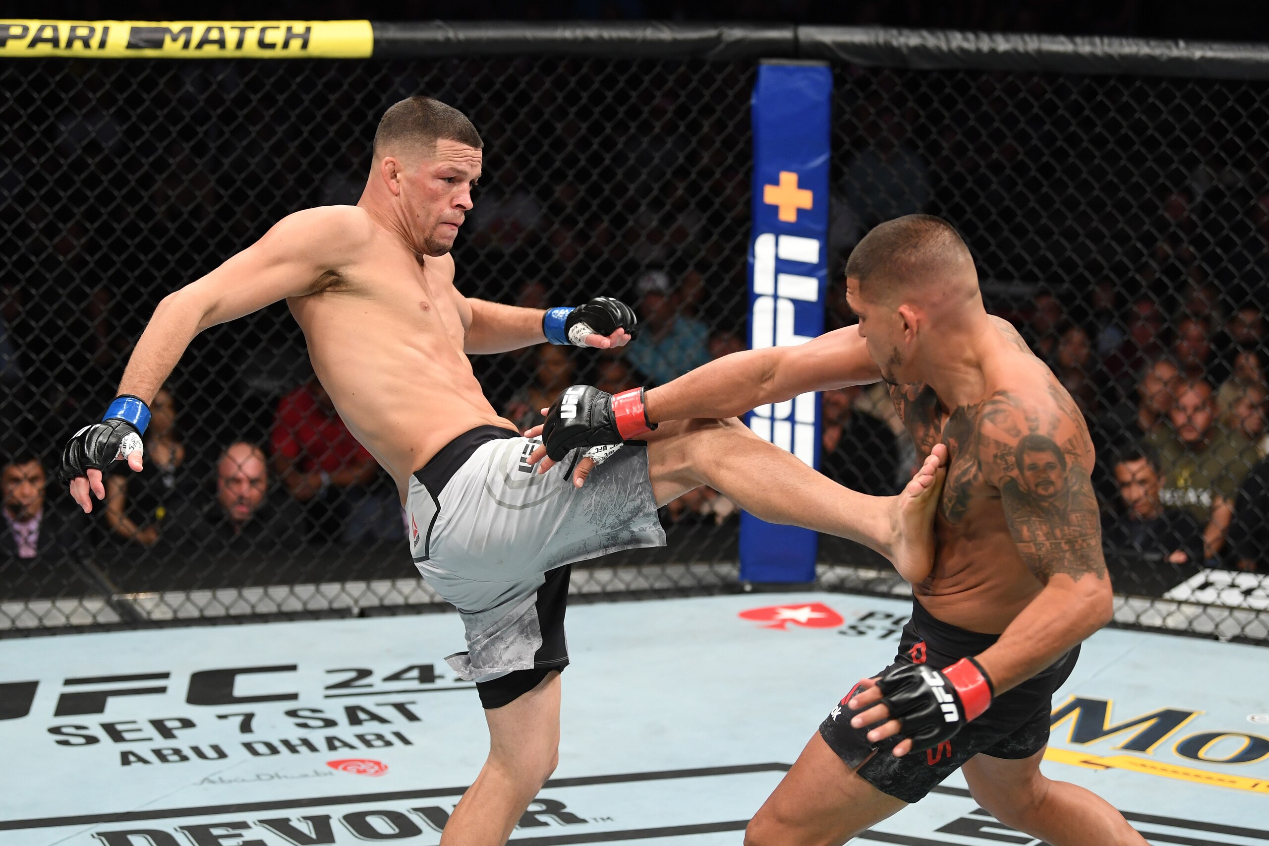ANAHEIM, CALIFORNIA - AUGUST 17:  (L-R) Nate Diaz kicks Anthony Pettis in their welterweight bout during the UFC 241 event at the Honda Center on August 17, 2019 in Anaheim, California. (Photo by Josh Hedges/Zuffa LLC/Zuffa LLC via Getty Images)