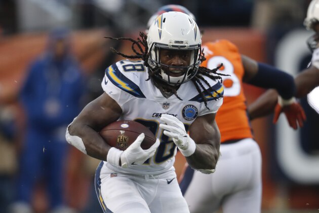 Los Angeles Chargers running back Melvin Gordon rushes during the second half of an NFL football game against the Denver Broncos, Sunday, Dec. 30, 2018, in Denver. (AP Photo/David Zalubowski)