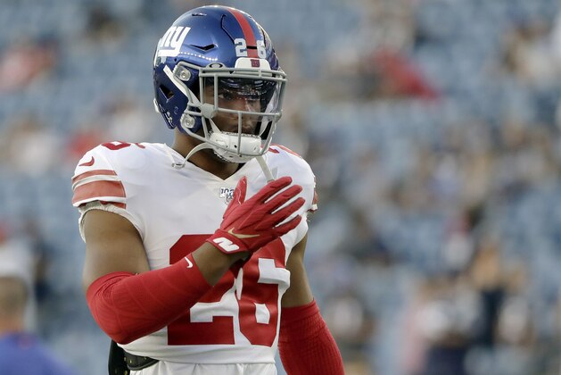 New York Giants running back Saquon Barkley warms up before an NFL preseason football game against the New England Patriots, Thursday, Aug. 29, 2019, in Foxborough, Mass. (AP Photo/Steven Senne)