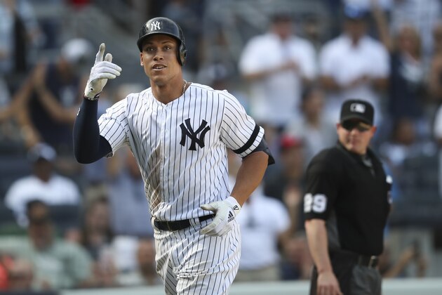 New York Yankees' Aaron Judge gestures as he crosses home plate after hitting a solo home run during the eighth inning of a baseball game against the Oakland Athletics, Saturday, Aug. 31, 2019, in New York. (AP Photo/Mary Altaffer)