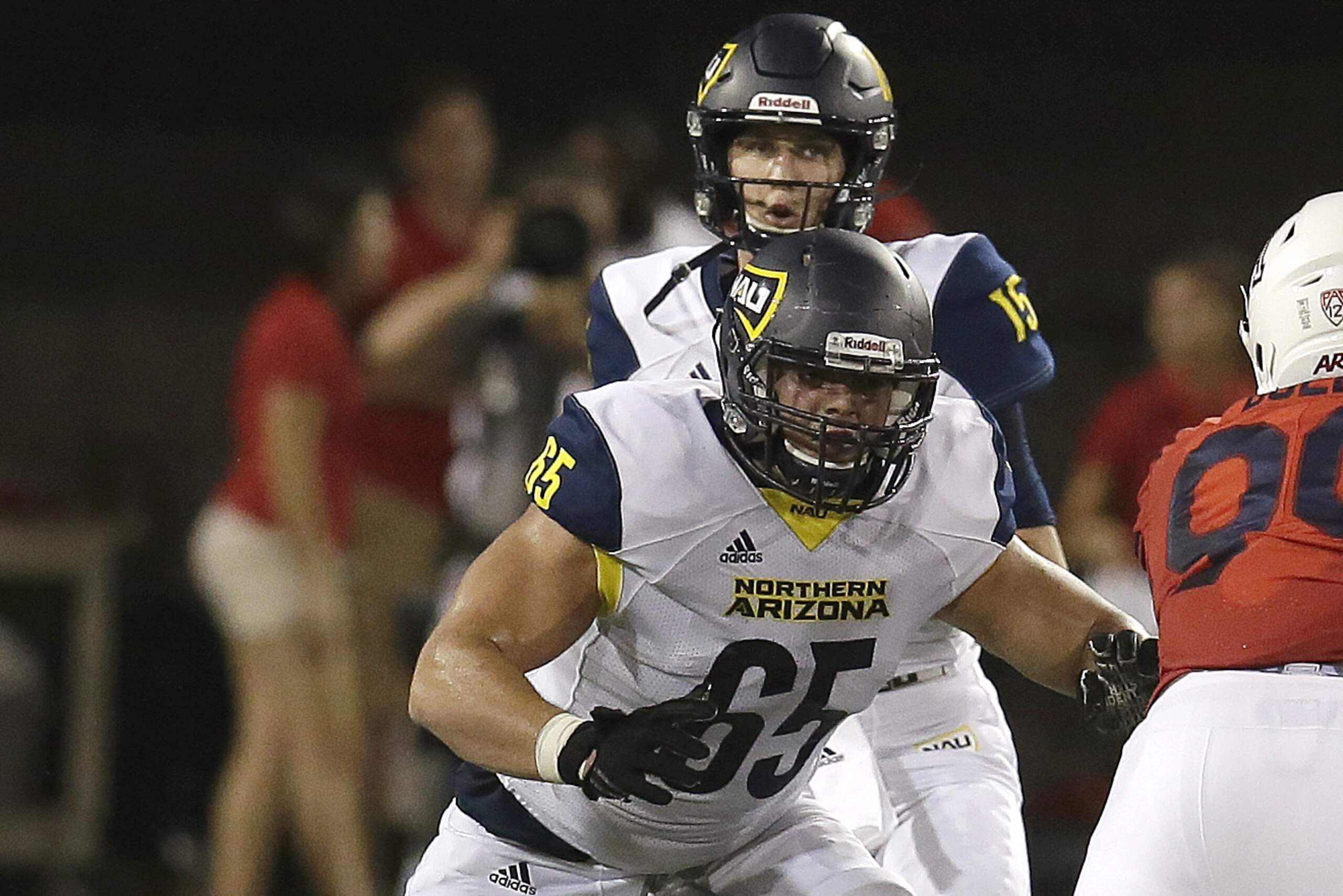 Northern Arizona offensive lineman Malik Noshi (65) in the first half during an NCAA college football game against Arizona, Saturday, Sept. 2, 2017, in Tucson, Ariz. (AP Photo/Rick Scuteri)