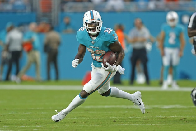 MIAMI GARDENS, FL - AUGUST 8: Kenyan Drake #32 of the Miami Dolphins runs with the ball against the Atlanta Falcons during a preseason NFL game on August 8, 2019 at Hard Rock Stadium in Miami Gardens, Florida. (Photo by Joel Auerbach/Getty Images)