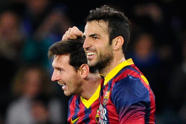 SAN SEBASTIAN, SPAIN - FEBRUARY 12:  Lionel Messi of FC Barcelona celebrates with his teammate Cesc Fabregas after scoring the opening goalduring the Copa del Rey Semi Final second leg between Real Sociedad and FC Barcelona at Anoeta Stadium on February 12, 2014 in San Sebastian, Spain.  (Photo by David Ramos/Getty Images)