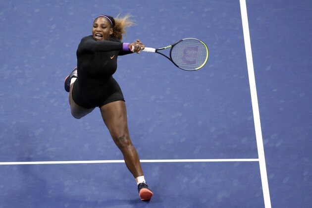 Serena Williams, of the United States, follows through on a return to Qiang Wang, of China, during the quarterfinals of the U.S. Open tennis tournament Tuesday, Sept. 3, 2019, in New York. (AP Photo/Seth Wenig)
