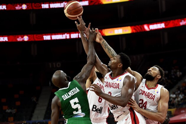 Canada's Khem Birch (R), Senegal's Xane d'Almeida (L) and Canada's Cory Joseph (2nd L) fight for the ball during the Basketball World Cup Group H game between Canada and Senegal in Dongguan on September 5, 2019. (Photo by Ye Aung Thu / AFP) (Photo credit should read YE AUNG THU/AFP/Getty Images) Canada's Khem Birch (R), Senegal's Xane d'Almeida (L) and Canada's Cory Joseph (2nd L) fight for the ball during the Basketball World Cup Group H game between Canada and Senegal in Dongguan on September 5, 2019. (Photo by Ye Aung Thu / AFP) (Photo credit should read YE AUNG THU/AFP/Getty Images)