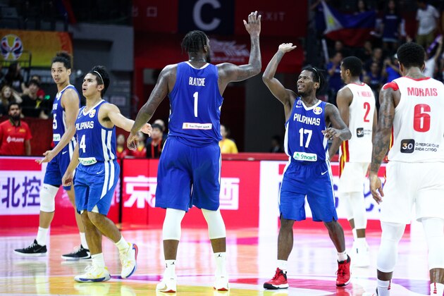 FOSHAN, CHINA - SEPTEMBER 04: #17 Jaymar Perez, #1 Andray Blatche, #4 Kiefer Ravena and #25 Japeth Aguilar of the Philippines National Team react during the match against the Angola National Team during the 1st round of 2019 FIBA World Cup at GBA International Sports and Cultural Center on September 4, 2019 in Foshan, China. (Photo by Zhong Zhi/Getty Images)