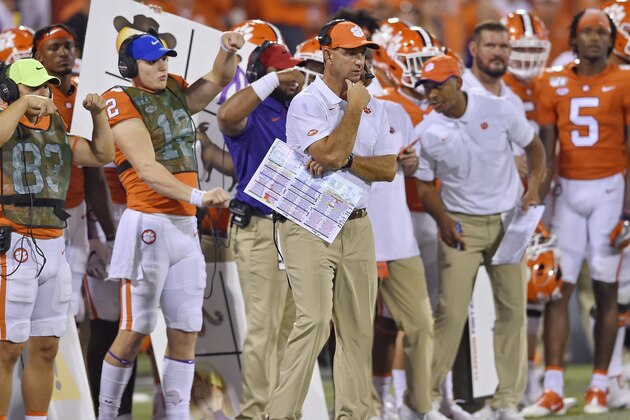 Clemson head coach Dabo Swinney, center, watches the action during the second half of an NCAA college football game against Georgia Tech Thursday, Aug. 29, 2019, in Clemson, S.C. Clemson won 52-14. (AP Photo/Richard Shiro)