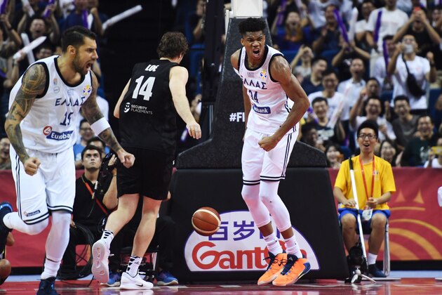 Greece's Giannis Antetokounmpo (L) celebrates scoring a basket during the Basketball World Cup Group F game between Greece and New Zealand in Nanjing on September 5, 2019. (Photo by WANG Zhao / AFP)        (Photo credit should read WANG ZHAO/AFP/Getty Images)