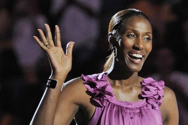FILE - This Aug. 10, 2010, file photo shows retired Los Angeles Sparks basketball player Lisa Leslie waving to the crowd during a ceremony to retire her jersey at halftime of a WNBA basketball game between the Indiana Fever and the Sparks in Los Angeles. Lisa Leslie was selected to the Naismith Hall of Fame, Monday, April 6, 2015. (AP Photo/Chris Pizzello, File)